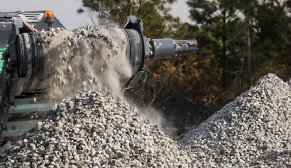 Concrete crushing operation on a construction site. Concrete and brick debris is turned into a product ideal for roads, driveways, and even building pads.